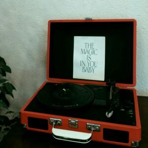 Retro record player with motivational quote displayed, ideal for vintage and motivational themes.